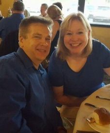 matching couple in royal blue eating together