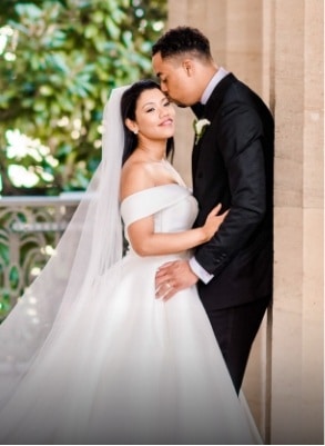 groom kissing her bride on the forehead