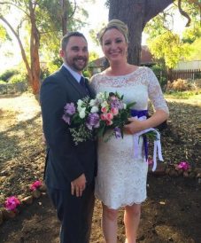 newly-wed couple under the shade of trees