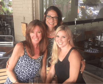 A group of Love U women smiling at the camera.