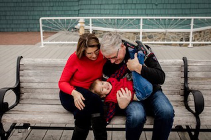 couple playing with their toddler boy