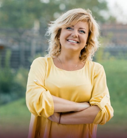 a successful, happy woman in yellow