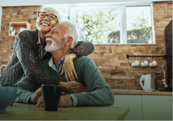 Love u success story of older couple happily cuddling hugging each other