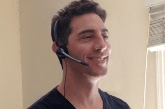 Evan Marc Katz on his headphone, smiling